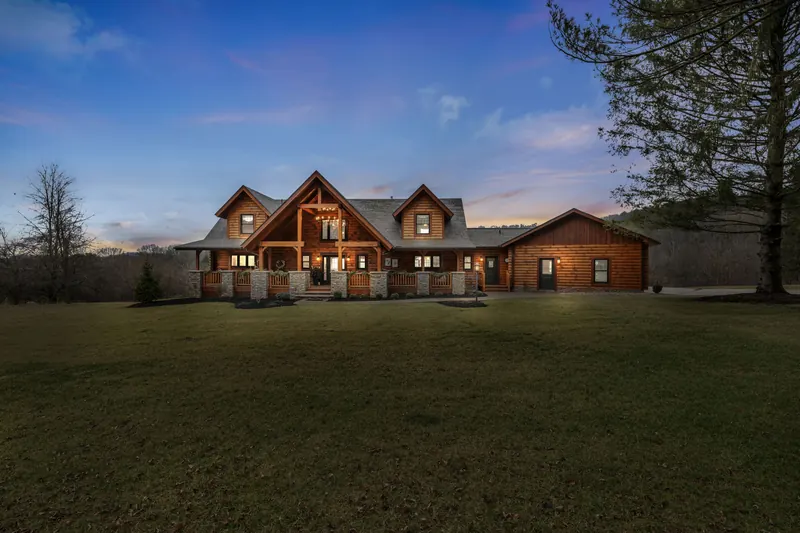 Frontline property marketing example: timber home at 3391 Trumpower Road in Perrysville, Ohio at dusk